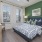a bedroom with a bed and lamps