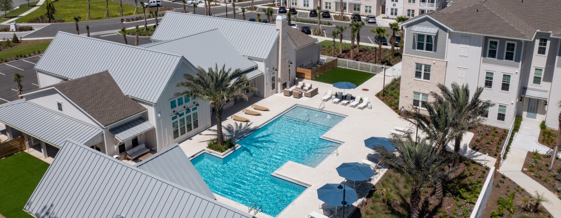 Resort-style swimming pool with lounge seating