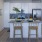 a kitchen with a table and chairs