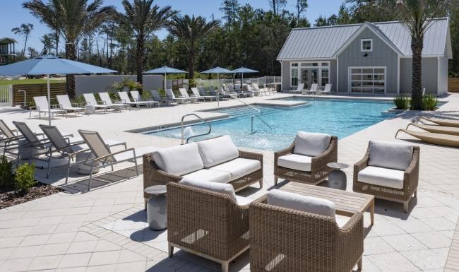 a pool with chairs around it