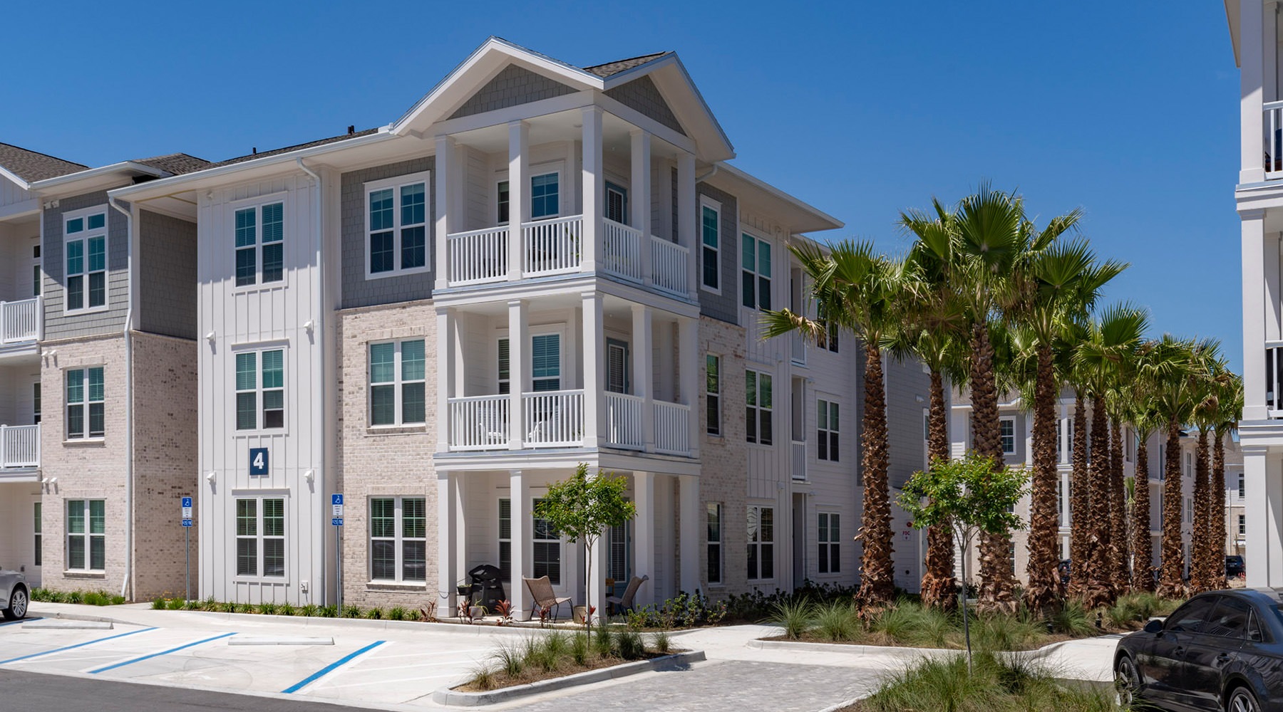 multi-level building with palm trees