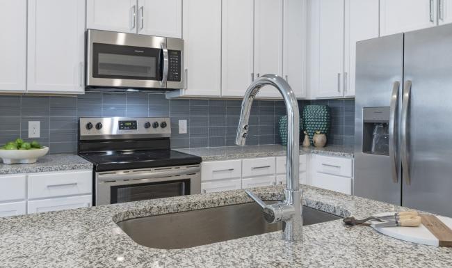 a kitchen with white cabinets
