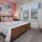 a bedroom with a bed and lamps